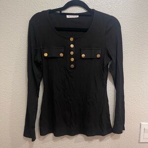 Stylish Black Long Sleeve Top with Gold Accents